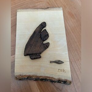 Indigenous wood carved wall hanging of man fishing signed by artist